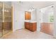 Main bathroom with a shower, vanity, tile floors, and entry to the main bedroom at 3134 Hudson Pond Ln, Marietta, GA 30062