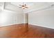 Spacious main bedroom features hardwood floors, large windows, and a ceiling fan at 3134 Hudson Pond Ln, Marietta, GA 30062