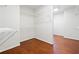 Walk-in closet features built-in shelving and hardwood floors at 3134 Hudson Pond Ln, Marietta, GA 30062