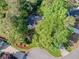 An aerial view of a home with mature landscaping, a driveway, and a cul-de-sac at 3298 Robinson Oaks Ne Way, Marietta, GA 30062