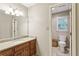 Bathroom features a granite vanity top and a view into an additional commode area at 3298 Robinson Oaks Ne Way, Marietta, GA 30062