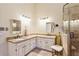 Main bathroom featuring double sinks, granite countertops, and a glass walk-in shower at 3298 Robinson Oaks Ne Way, Marietta, GA 30062