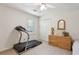 Bright bedroom with ceiling fan, neutral walls, a treadmill, and ample closet space at 3298 Robinson Oaks Ne Way, Marietta, GA 30062