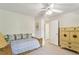 Comfortable bedroom with ceiling fan, daybed, and dresser with closet access at 3298 Robinson Oaks Ne Way, Marietta, GA 30062