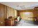 Exercise room with wood-paneled walls, space for equipment, and home office space at 3298 Robinson Oaks Ne Way, Marietta, GA 30062