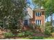 Charming two-story home with a combination brick and stucco facade, featuring a landscaped front yard at 3298 Robinson Oaks Ne Way, Marietta, GA 30062