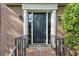 Close up of front door, showing brick entryway with dark door at 3298 Robinson Oaks Ne Way, Marietta, GA 30062