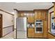 Well-equipped kitchen with stainless steel refrigerator, wooden cabinets, and modern appliances at 3298 Robinson Oaks Ne Way, Marietta, GA 30062
