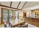 Eat-in kitchen with breakfast bar, wooden cabinets and trim, and large windows with backyard view at 3298 Robinson Oaks Ne Way, Marietta, GA 30062