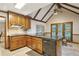 Charming kitchen with wood cabinets, granite countertops, and a vaulted ceiling at 3298 Robinson Oaks Ne Way, Marietta, GA 30062