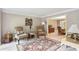 A well-lit living room provides a comfortable area with coordinated furnishings and a peek into the dining space at 3298 Robinson Oaks Ne Way, Marietta, GA 30062
