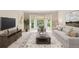 Comfortable living room with large windows, modern decor, and plenty of natural light at 3298 Robinson Oaks Ne Way, Marietta, GA 30062