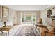A serene living room boasts a bay window offering ample natural light and views of the landscaped outdoors at 3298 Robinson Oaks Ne Way, Marietta, GA 30062