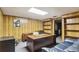 This office features wood paneling and built-in shelves, complemented by a desk and comfortable seating area at 3298 Robinson Oaks Ne Way, Marietta, GA 30062