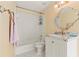 Bathroom featuring a vanity with marble countertop and a shower-tub combo at 710 Leeds Garden Ter, Alpharetta, GA 30022