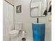 Stylish bathroom featuring a blue sink, white walls, and new fixtures at 710 Leeds Garden Ter, Alpharetta, GA 30022