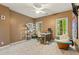 Comfortable bedroom featuring a built-in bookshelf and a dedicated workspace with natural light at 710 Leeds Garden Ter, Alpharetta, GA 30022