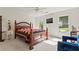 A cozy bedroom that features carpet floors, windows for natural light, and modern ceiling fan at 710 Leeds Garden Ter, Alpharetta, GA 30022