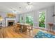 Dining room with lots of natural light and a view of the trees at 710 Leeds Garden Ter, Alpharetta, GA 30022