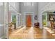 Elegant foyer features high ceilings and a decorative wood front door at 710 Leeds Garden Ter, Alpharetta, GA 30022