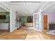 Open foyer with wood floors that features the home's staircase at 710 Leeds Garden Ter, Alpharetta, GA 30022