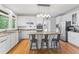 Modern kitchen with granite countertops, stainless steel appliances, and center island at 710 Leeds Garden Ter, Alpharetta, GA 30022