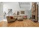 Bright and airy living room with stone fireplace and hardwood floors at 710 Leeds Garden Ter, Alpharetta, GA 30022