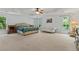 Spacious bedroom with a decorative tray ceiling, and plenty of natural light at 710 Leeds Garden Ter, Alpharetta, GA 30022