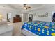 Main bedroom with connecting rooms, carpet flooring, and an abundance of natural light at 710 Leeds Garden Ter, Alpharetta, GA 30022
