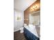 Cozy bathroom with stylish bowl sink, attractive mirror and modern fixtures at 7156 Whitfield Dr, Riverdale, GA 30296