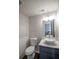 Cozy bathroom with stylish bowl sink, attractive mirror and modern fixtures at 7156 Whitfield Dr, Riverdale, GA 30296