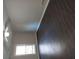 Well-lit bedroom featuring laminate floors and an exterior window at 7156 Whitfield Dr, Riverdale, GA 30296
