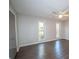 Comfortable bedroom with hardwood floors, ceiling fan, and natural light at 7156 Whitfield Dr, Riverdale, GA 30296