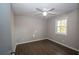 Comfortable bedroom featuring modern flooring, neutral paint and natural light at 7156 Whitfield Dr, Riverdale, GA 30296