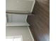 Spacious closet with ample storage and modern laminate floors at 7156 Whitfield Dr, Riverdale, GA 30296