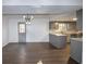 Open-concept kitchen with gray cabinets, modern countertops, and stainless steel appliances at 7156 Whitfield Dr, Riverdale, GA 30296