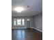 Inviting living room with natural light and a view from the large front window at 7156 Whitfield Dr, Riverdale, GA 30296