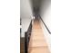 Bright, carpeted staircase with railing leading to the upper level at 7156 Whitfield Dr, Riverdale, GA 30296