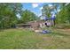 Large backyard with a carport attached to the house at 1192 Pathfinder Rd, Marietta, GA 30066