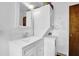 Bathroom featuring a stackable washer and dryer, vanity, and mirrored cabinet at 1192 Pathfinder Rd, Marietta, GA 30066