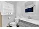 Bathroom with white vanity, toilet, and shower with black and white tile at 1192 Pathfinder Rd, Marietta, GA 30066