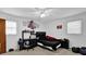 Bedroom featuring a bed, desk, fan and window at 1192 Pathfinder Rd, Marietta, GA 30066