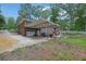 Back exterior featuring a carport and lawn at 1192 Pathfinder Rd, Marietta, GA 30066