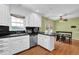 Kitchen with stainless steel appliances, an eat-in dining area, and wood flooring at 1192 Pathfinder Rd, Marietta, GA 30066