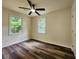 Cozy bedroom featuring new laminate flooring, a ceiling fan, and natural light from the windows at 188 Oak Dr, Atlanta, GA 30354
