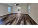 Spacious living room with hardwood flooring, ceiling fan, and natural light from the windows at 188 Oak Dr, Atlanta, GA 30354