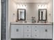 Well-lit bathroom featuring double vanity sinks, lots of storage, and a neutral color scheme at 209 Shelton Cir, Temple, GA 30179