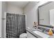 Bathroom featuring a single sink vanity, shower with tub, and neutral finishes at 209 Shelton Cir, Temple, GA 30179