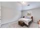 Bright bedroom with soft carpet, neutral walls, a large window, and a comfy bed at 209 Shelton Cir, Temple, GA 30179