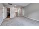 Neutral bedroom featuring plush carpeting, gray walls, and a hallway leading to other rooms at 209 Shelton Cir, Temple, GA 30179